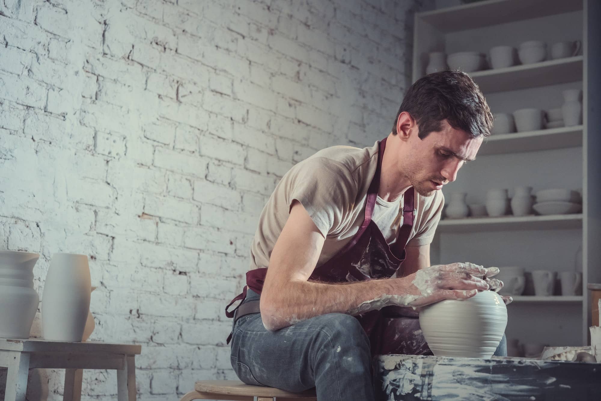 Worker making a ceramic vase